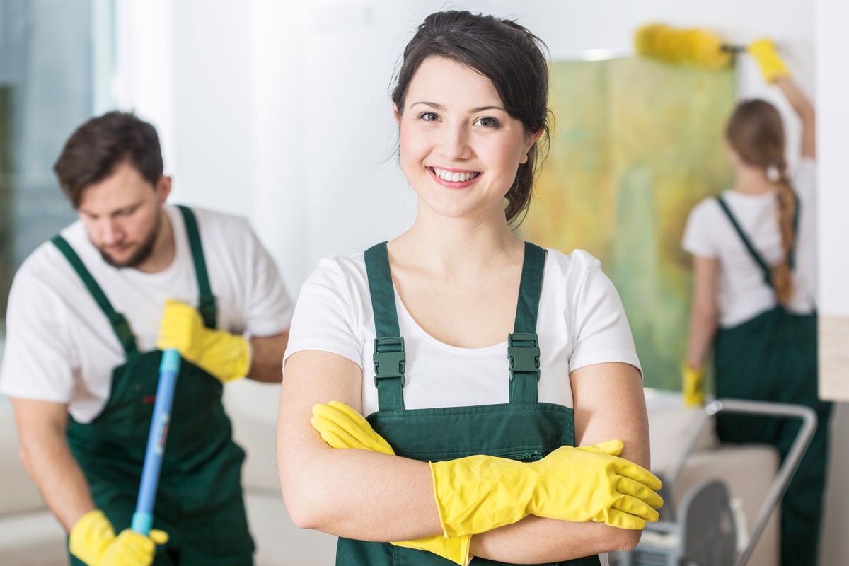 happy maid ready to start the cleaning work